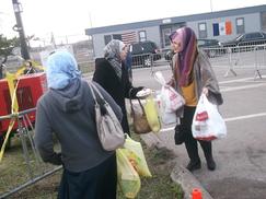 Safiyya distributing food to devastated victims in Staten Island