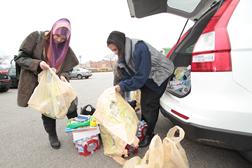 Safiyya and Marie-France preparing the supplies for the victims in Coney Island